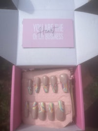 a box with a set of nail polishes in it